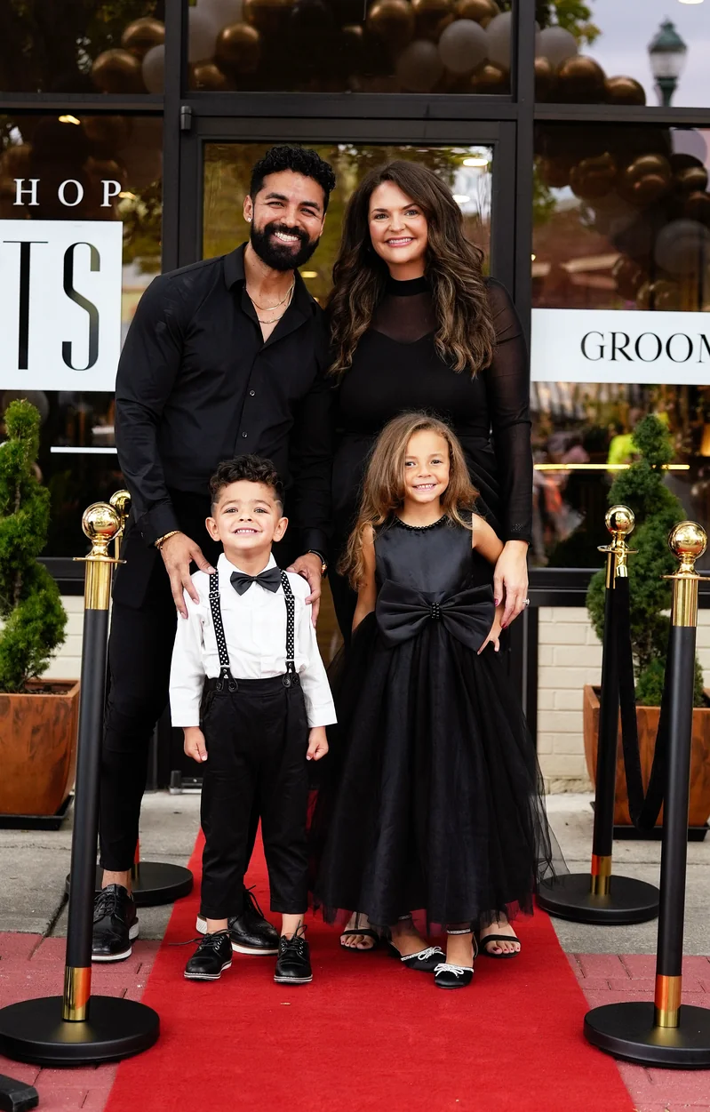 Whitney with her family in the community