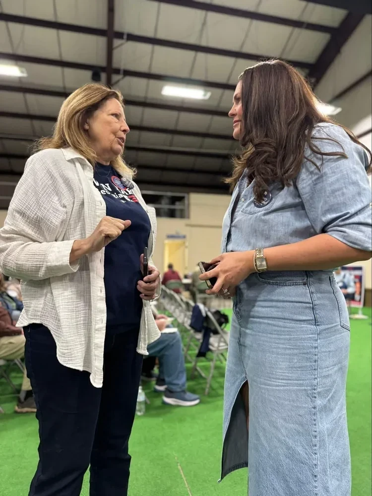 Whitney engaging in a conversation with a local voter